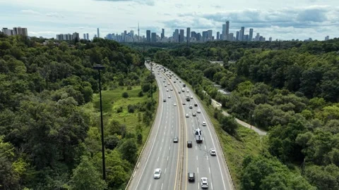 Aerial Drone Hovers Over Don Valley Parkway With Toronto Skyline in View Stock-Footage 345835190