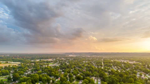 Aerial Drone Hyper Lapse Circle Storm Clouds over Suburbia with Sunset Stock Footage 279865803
