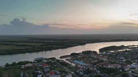 Aerial drone hyper lapse of sunset over Saint George settlement in Danube Delta Stock Footage 286967398