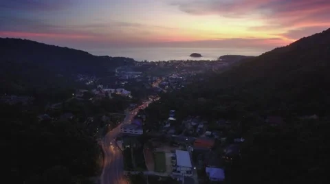 Aerial Drone Hyperlapse at Dusk of Traffic on Road at Kata Beach Phuket Thailand Stock Footage 66331954