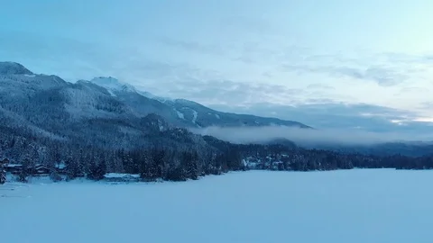 Aerial drone hyperlapse of snow covered trees with Whistler Mountain in the Stock Footage 124396504