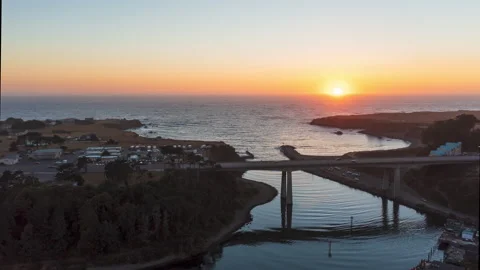 Aerial drone hyperlapse into the sunset over a harbor during golden hour Stock-Footage 220527414