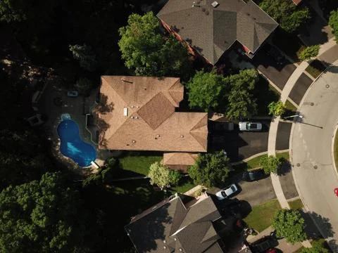 Aerial drone image (top down) of suburban houses on a sunny summer day. Stock Photos