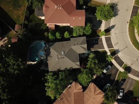 Aerial drone image (top down) of suburban houses on a sunny summer day. Stock Photos