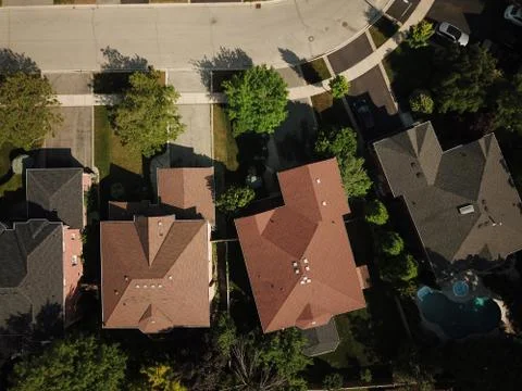 Aerial drone image (top down) of suburban houses on a sunny summer day. Stock Photos