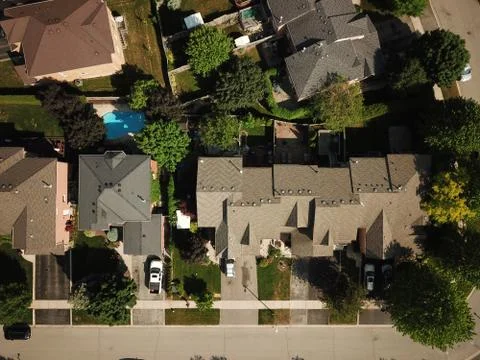 Aerial drone image (top down) of suburban houses on a sunny summer day. Stock Photos