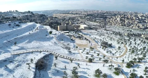 Aerial drone Israel Middle Eastern city Jerusalem snow Mount Scopus lookout Stock Footage 79078731
