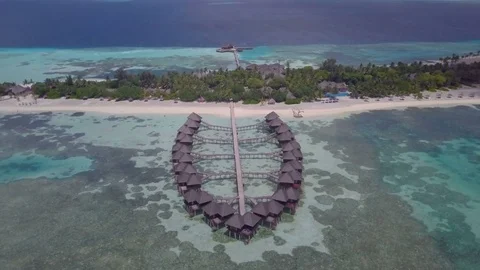 Aerial Drone Jib Down and Towards Water Villas in the Maldives Stock-Footage 80943211