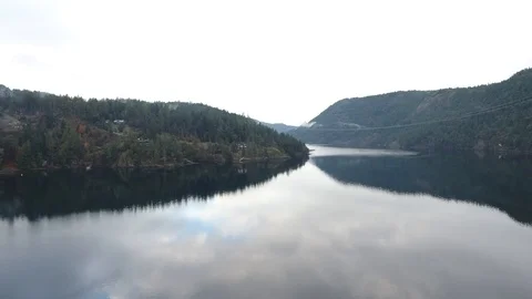 Aerial drone of lake with clouds reflect in water Video stock 126982007