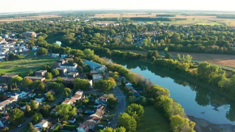Aerial Drone of L'Assomption Quebec: Suburbs, River and Farmland During Sunset Stock-Footage 164677329