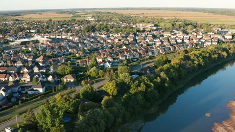 Aerial Drone of L'Assomption Quebec: Suburbs and River During Sunset 動画素材 165290667