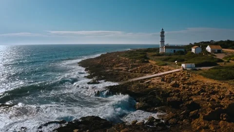 Aerial Drone Lighthouse at Cape de Ses Salines on MaJorca island, Spain Medi Stock Footage 144629341