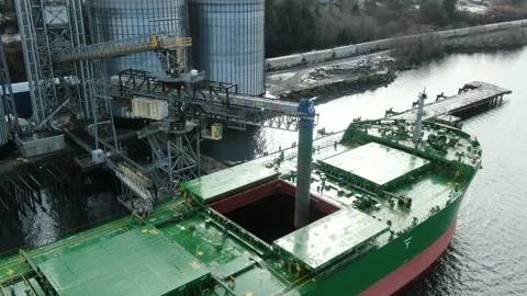 Aerial Drone: Loading wood pellets into a bulk freighter Stock Footage 150121559