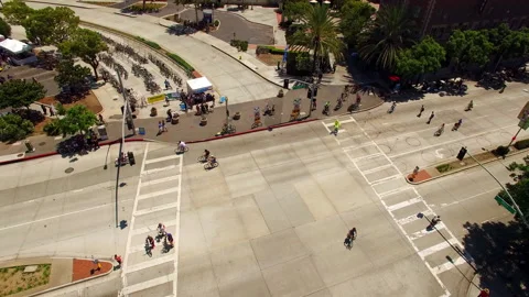 Aerial: Drone Lockdown Shot Of Men And Women Riding Bicycles On Road During Stock Footage 278426840
