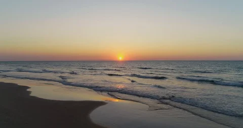 Aerial drone low angle view of beautiful sunset over the sea. Golden sun Video stock 128253812