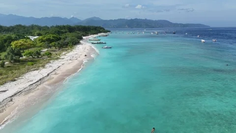 Aerial Drone Low Flight Pullback Along Gili Meno West Beach With Boats Stock-Footage 330977267
