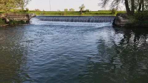 Aerial Drone Low Flight Rising Over River Waterfall and Dam Video stock 332995355