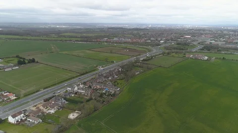 Aerial Drone M1 roundabout exit with Leeds in background Stock Footage 105736617