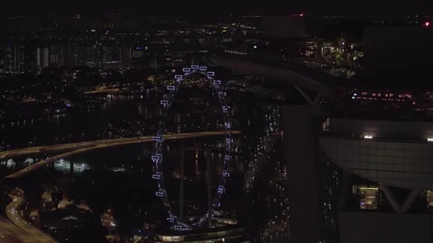 Aerial Drone of MBS Skypark Infinity Pool and Singapore Flyer Stock Footage 273678823