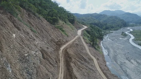 AERIAL DRONE  OF MOUNTAIN SIDE ROAD CONSTRUCTION (4K) Stock Footage 130169166