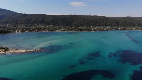 Aerial drone movement to the left over blue turquoise lagoon Stock Footage 91969488