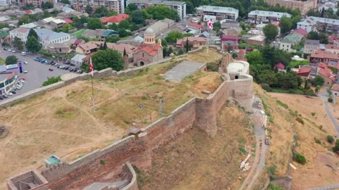 Aerial drone moves sideways around Gori Fortress in Georgia, presenting the Stock Footage 340765764