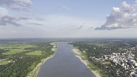 Aerial Drone Moving Backward Over River Between Kushtia City and Green Nature Stock Footage 342516943