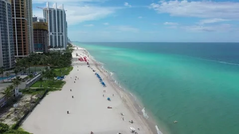 Aerial drone moving forward on the coast of Aventura in florida Stock Footage 252865534