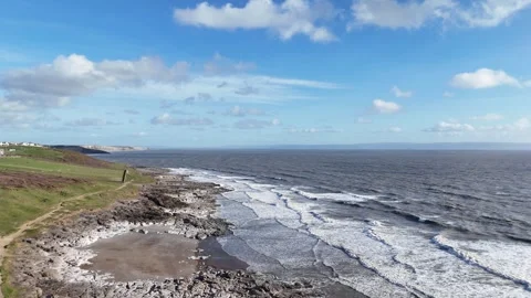 Aerial Drone Moving Over Beach Toward Sea and Landscape, Wales UK 4K Vidéo 334066755