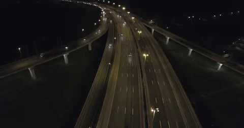 Aerial drone night flight over  highway interchange Stock Footage