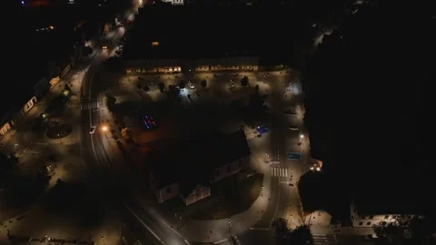 Aerial Drone Night Orbit Right Around Illuminated Town Square Stock Footage 323769934
