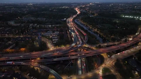 Aerial drone night view of a multi-level highway intersection with moving cars Stock Footage 293670638