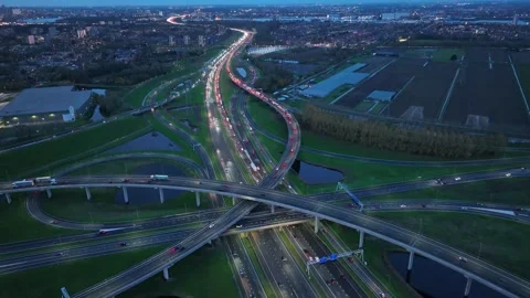 Aerial drone night view of a multi-level highway intersection with moving cars Stock Footage 301855420