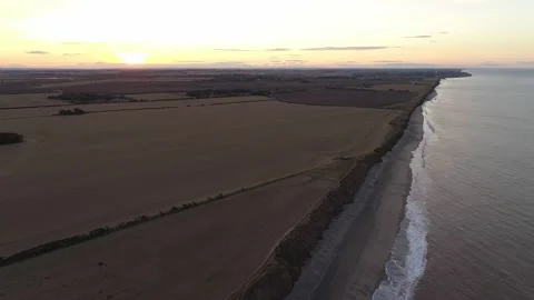 Aerial Drone - Open Fields and Cars on Road at Sunset. East Yorkshire Coast. Stock Footage 219485804