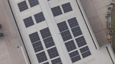 Aerial Drone Orbit and Ascend Over Building with Solar Panels Stock-Footage 334007513