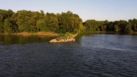 Aerial Drone Orbit Around Forest and River at Sunset Stock Footage 313830833