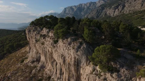Aerial Drone Orbit Around a Forested Sea Cliff in Croatia (Daytime) Video stock 320145940