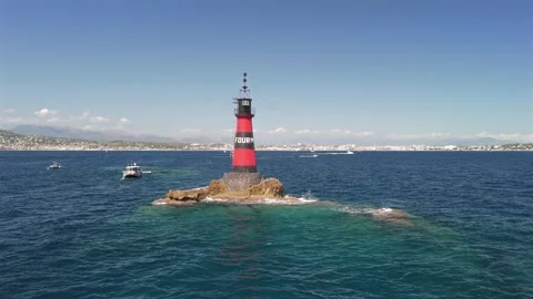 Aerial drone orbit around Fourmigue rock and Juan-les-Pins bay France.horiz.. Stock Footage 344752593