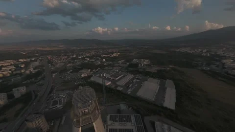 Aerial drone orbit around modern skyscraper rooftop at sunset in Sofia, Bulgaria Stock Footage 340270131