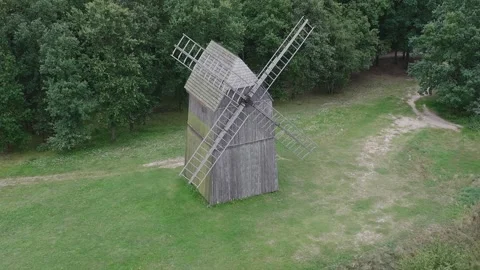 Aerial Drone Orbit Around Windmill Revealing Lednica Lake Panorama Stock Footage 324975893