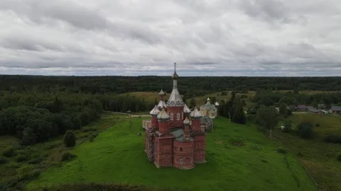 Aerial drone orbit of the historic monastery church in Volgoverkhovye Stock Footage 338094403