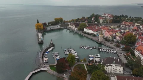 Aerial drone orbit over calm marina with yachts on Lindau Island, Germany Stock Footage 319789749