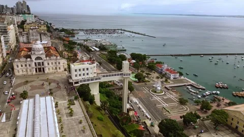 Aerial drone orbit over Lacerda Elevator and Todos os Santos Bay in Salvador Stock Footage 342889040