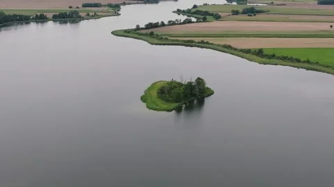 Aerial Drone Orbit Right Around Small Island on Lednica Lake Video stock 324976189