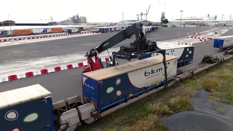 Aerial Drone Orbit View of BKM Logistics Freight Train and Reach Stacker Crane Stock Footage 337976473