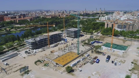 Aerial Drone orbit view of construction site with cranes, trucks Stock Footage 130007768