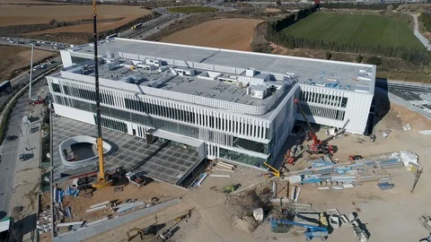 Aerial Drone Orbit view of construction site of building Stock Footage 130008017