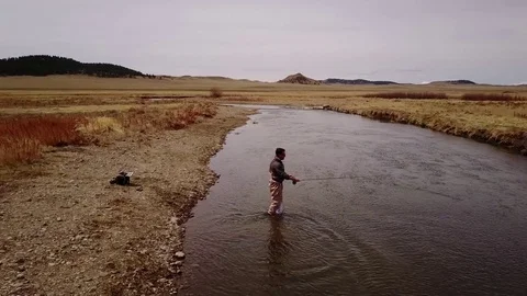 Aerial Drone Orbital View of Fly Fisherman in River Stock-Footage 74253113