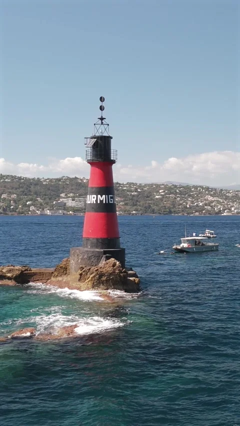 Aerial drone orbiting Fourmigue rock near Antibes France.vertical Stock Footage 344752339