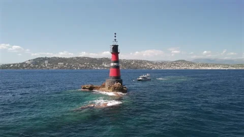 Aerial drone orbiting Fourmigue rock near Antibes France.horizontal Stock Footage 344752352